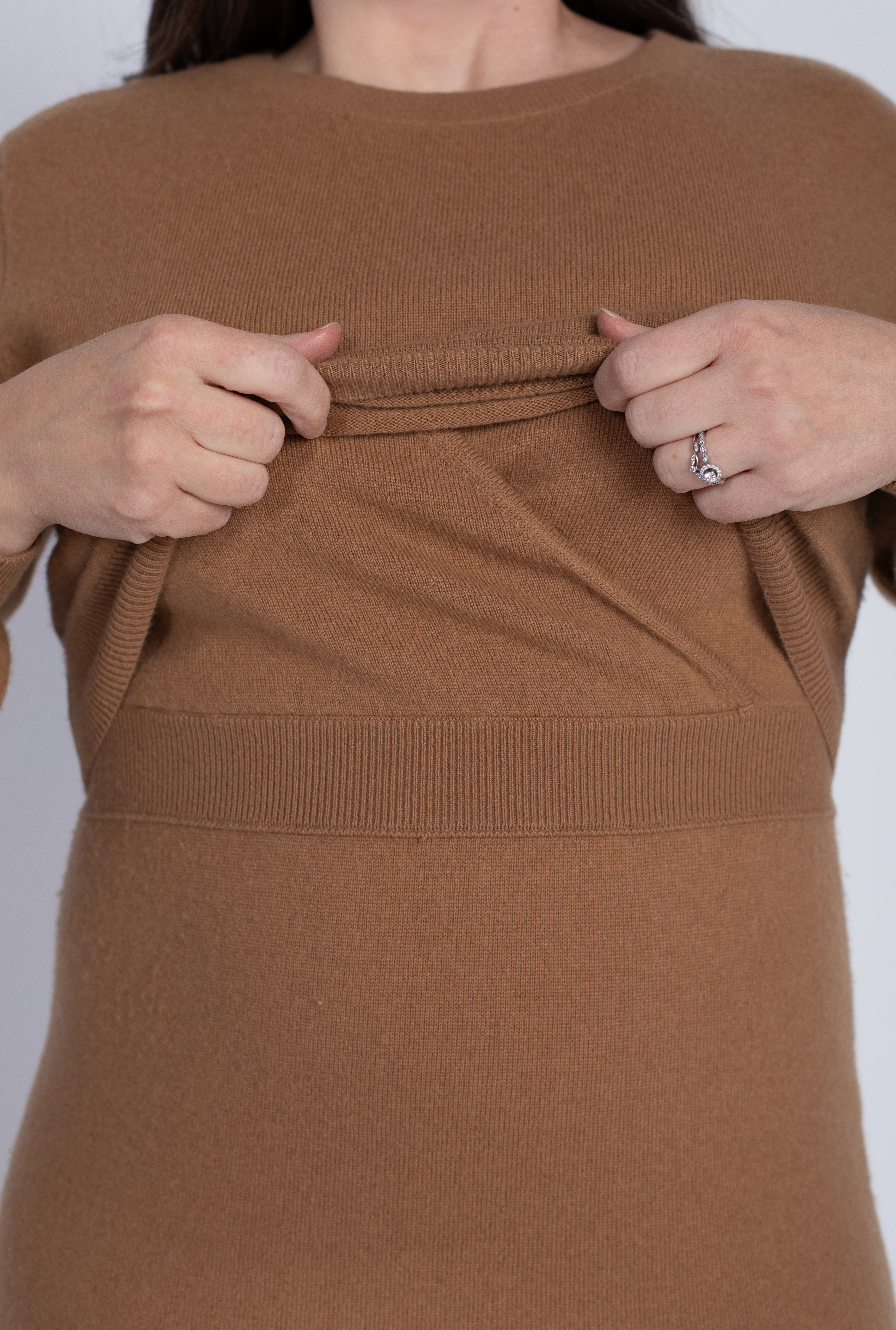 Close-up detail of the Hone Signature Knit Dress in Camel, demonstrating the invisible lift-up nursing access panel for discreet breastfeeding or pumping.